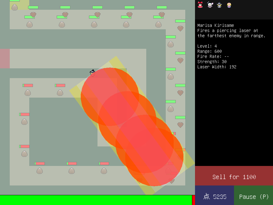 Screenshot of the game showing Marisa firing a large laser with 4 circular hitboxes within it.